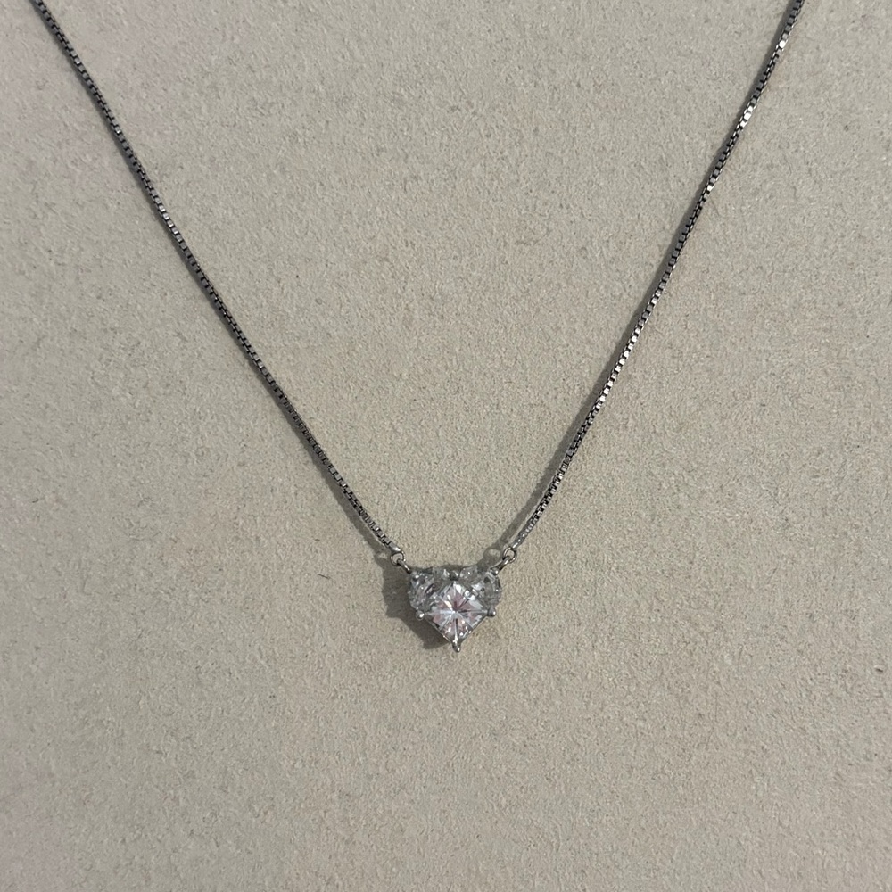 Moissanite heart shape necklace in sterling silver.
